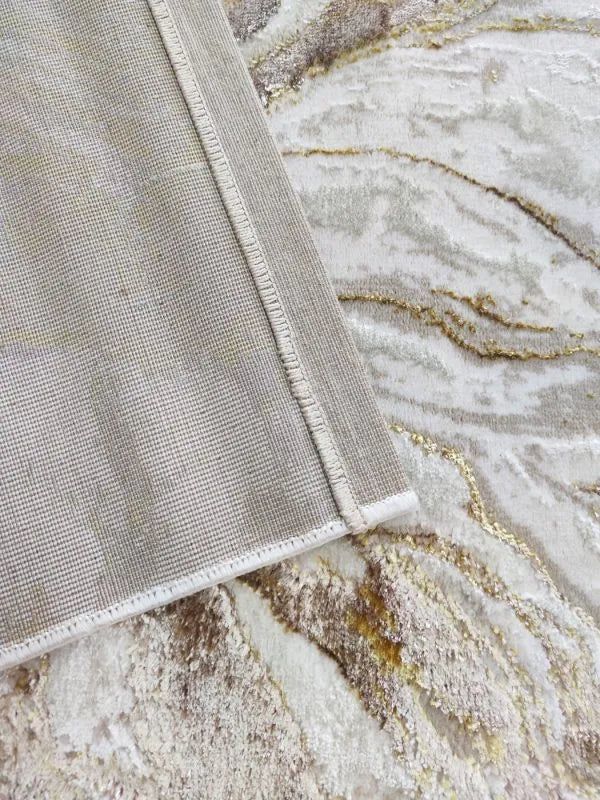 Alfombra dorada de Zara